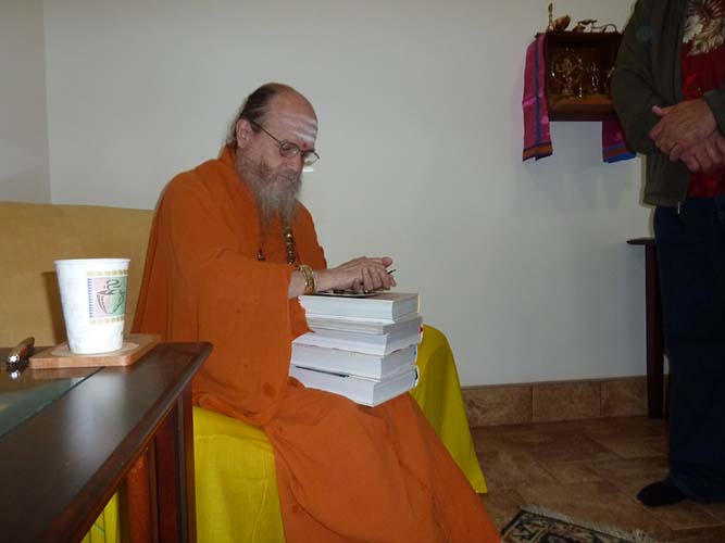 Bodhinatha Signs Books For Visitors